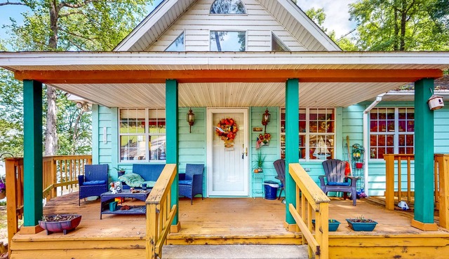 Waterfront stay with boat launch, private beach, wrap-around deck, & grill