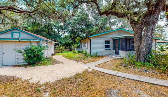 Waterfront stay with a dock, firepit, grill, sunroom, separate studio, W/D, & AC