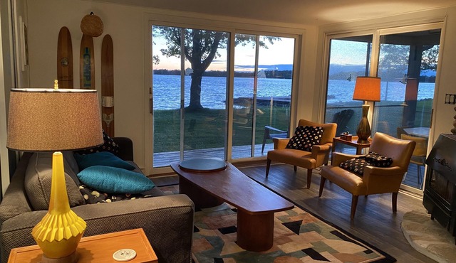 Waterfront, sunlit cozy cottage with large dock, fire pit and good swimming.