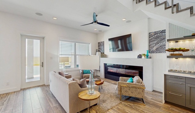 Waterfront townhome with dock, canal view & fireplaces - walk to beach