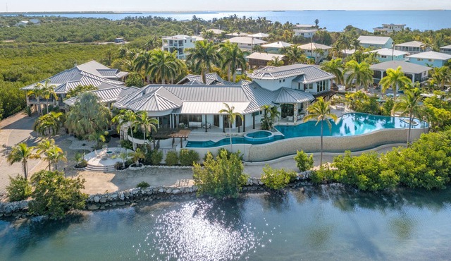 Waterfront villa with pool, outdoor areas, home gym, & fillet station