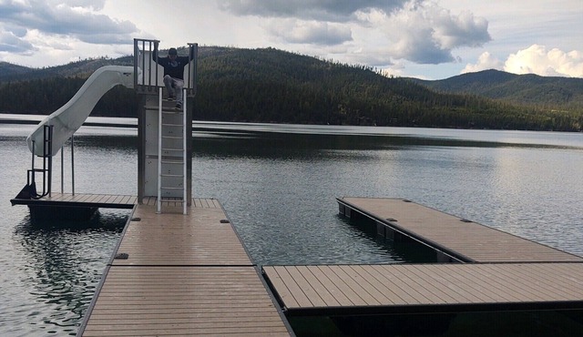 Waterfront w/ Water Slide, Rock Climbing Wall & Ice Fishing Shanty in Winter