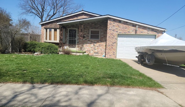 Waterfront with Boat Dock on Detroit River Channel. Fish from the backyard