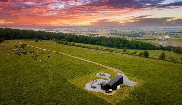 we invite u to come experience this off grid tiny home on top of a grassy hilltop.