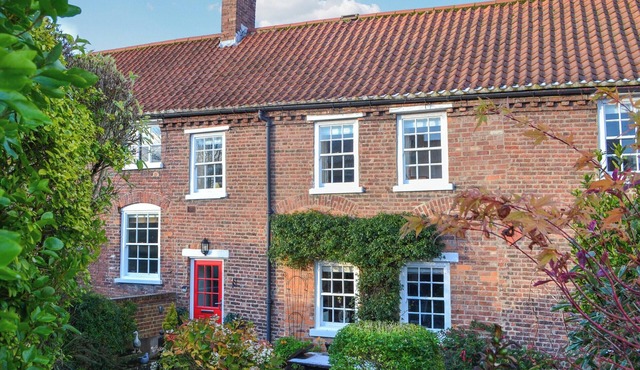 We love the courtyard location of this historic cottage.