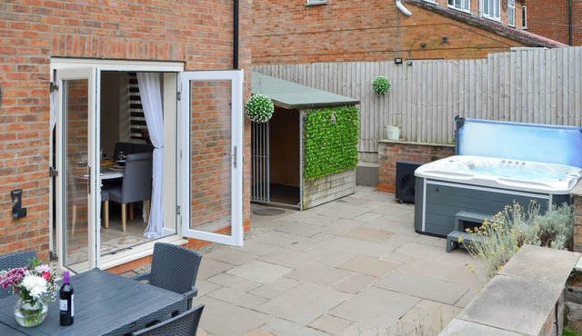 We love the open plan living area with wood burner.