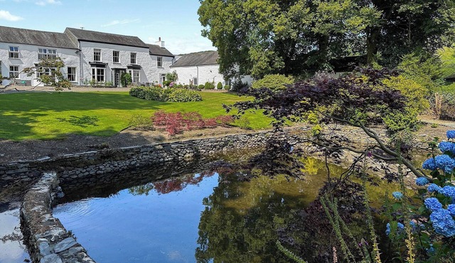 We love this elegant 18th-century property, set in beautiful grounds and woods.