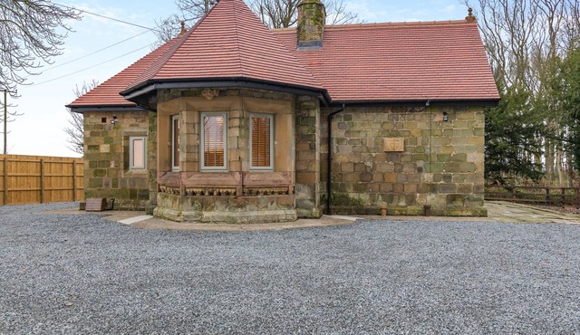 We love this historic lodge with large garden and wood fired hot tub.