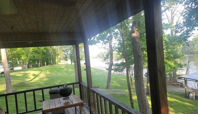 Weekend getaway at scenic Black River Lake with floating dock and boathouse.