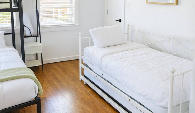 Welcome! This stylish and spacious three-story gateway