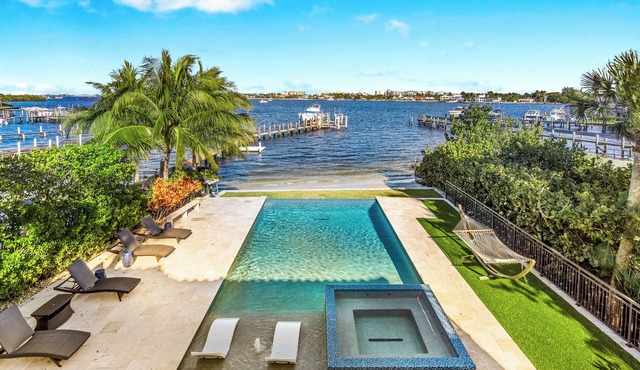 Welcome to "Once Upon a Tide" - A magnificent waterfront home with infinity pool