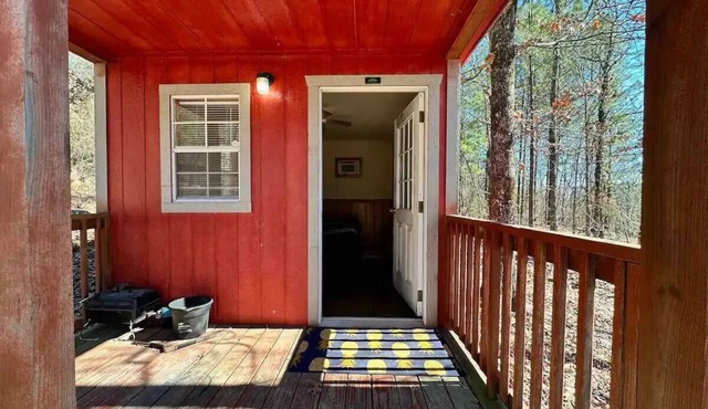 Welcome to our charming tiny house cabin at Blue Clouds Resort!