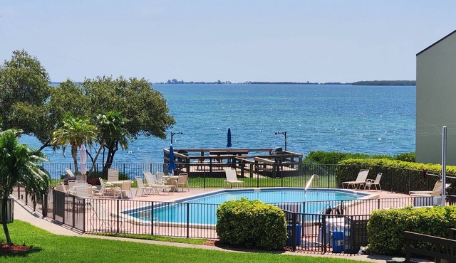 Welcome to the island lifestyle ! Gorgeous 2 BR, 1st floor, waterfront condo