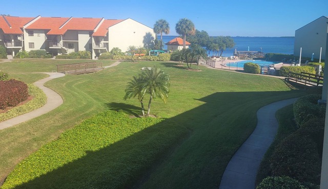 Welcome to the island lifestyle with garden and pool views on Tierra Verde!