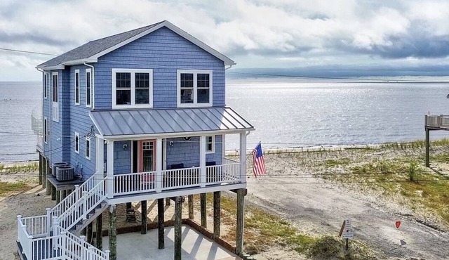 Welcome to the waterfront oasis in the serene community of Kitts Hummock Beach!n