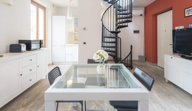 Welcome to this shining three levels apartment located in the heart of Navigli City Centre of Milan