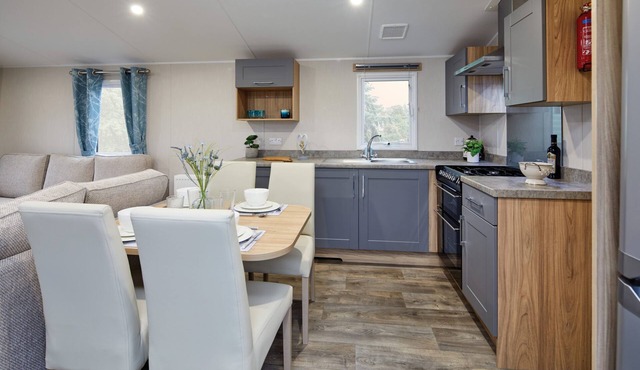 Well appointed caravan with patio doors and decking.