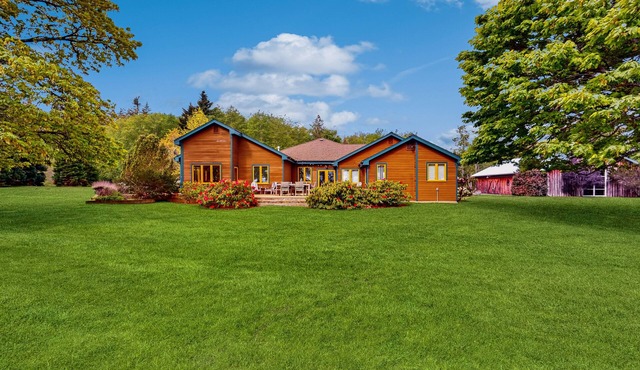 Whidbey Island waterfront acreage with gardens, pond, chef's kitchen, & studio