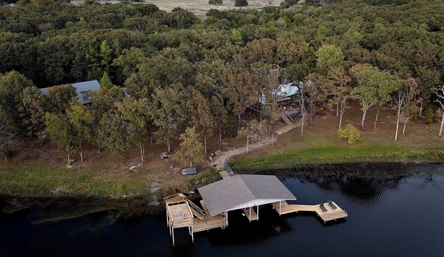 WHISPERING PINES — PRIVATE LAKEFRONT RETREAT ON 240 ACRES