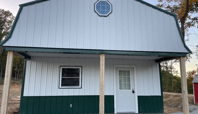 White cabin in the woods close to Univ. of Central Missouri and Whiteman AF Base