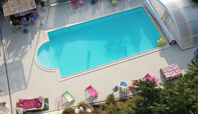 white stone cottage very well restored, surrounded by nature, with swimming pool
