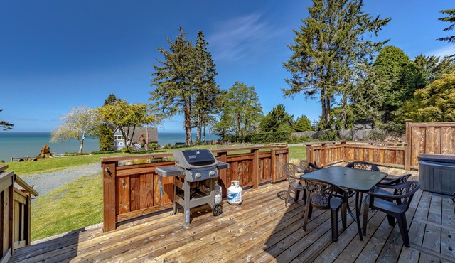 Wild ocean views, wrap-a-round deck, hot tub, expansive grounds with shared picnic tables