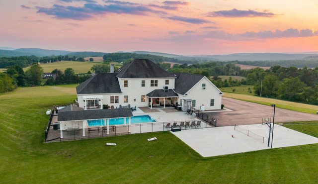 Willow Brook Mansion, an upscale retreat in the countryside with heated pool, hot tub and game room.