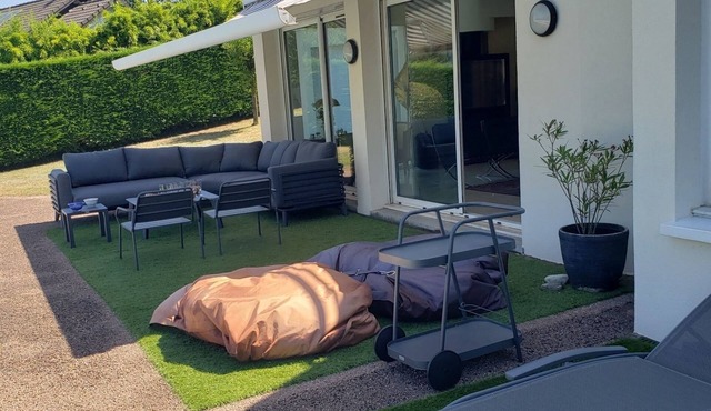 With its feet in the water, this superb contemporary villa