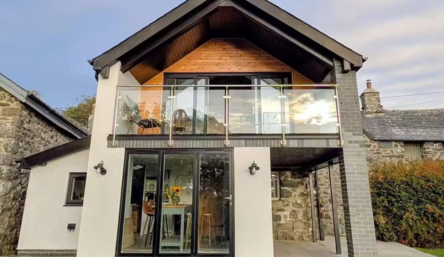 Wonderful historical farmhouse in Snowdonia including balcony with sea views.