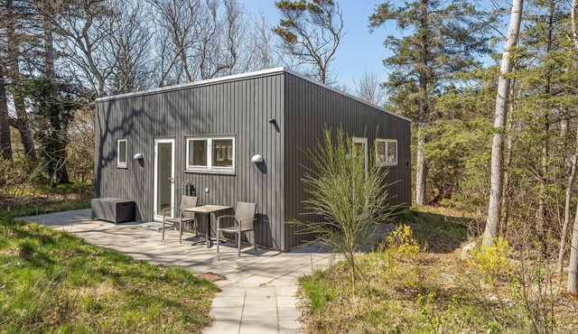 Wonderful, modern home on wooded lot right on the water.