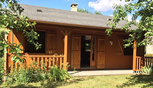 WOOD FRAME HOUSE WITH TERRACE AND LAND TREES