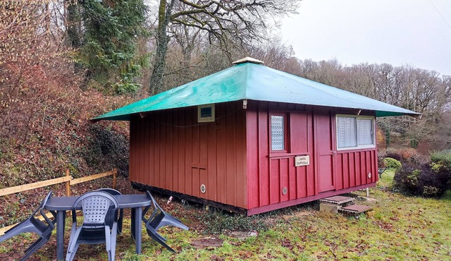 Wooden cabin in the heart of nature with pond
