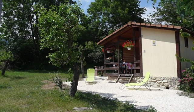 Wooden chalets in gite village with terrace, barbecue, swimming pool and air conditioning