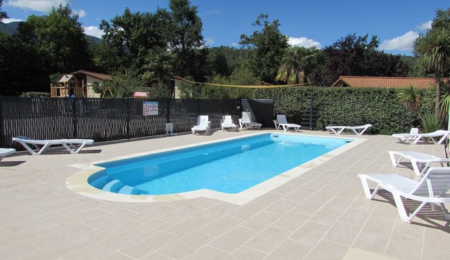 Wooden chalets in gite village with terrace, barbecue, swimming pool and air conditioning