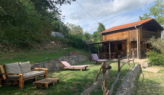 Wooden chalet in a verdant environment at the foot of the Mount Canigou