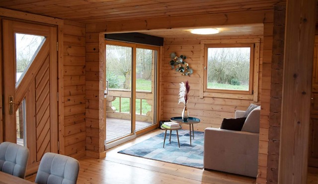 Wooden cottage for 6 people located on the edge of a private pond.