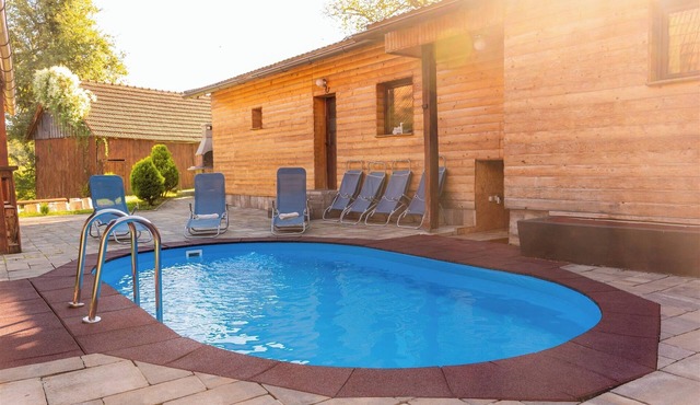 Wooden forest home with pool, fireplace and playground for kids