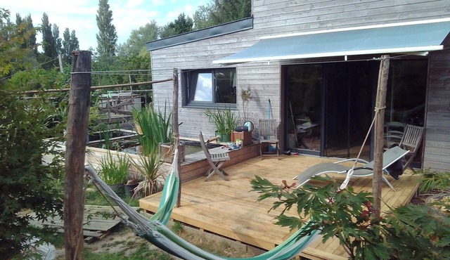 Wooden house between sea and countryside