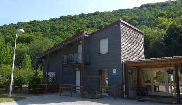 Wooden house by the canal with terrace and games
