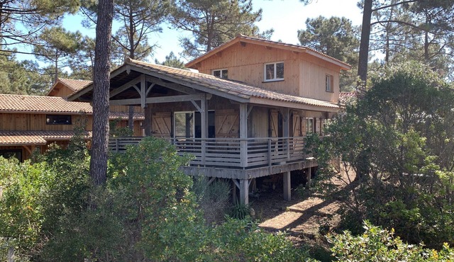 Wooden house close to the ocean in a gated community.