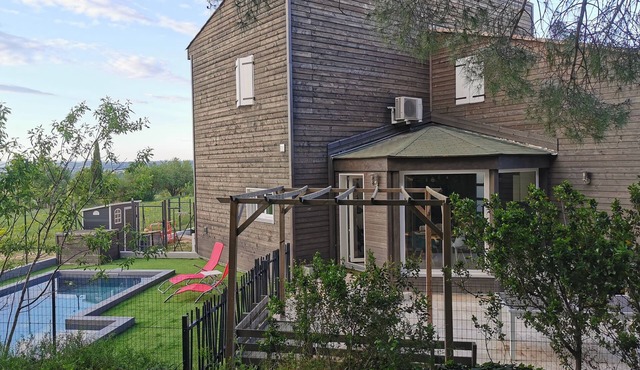 Wooden house with swimming pool