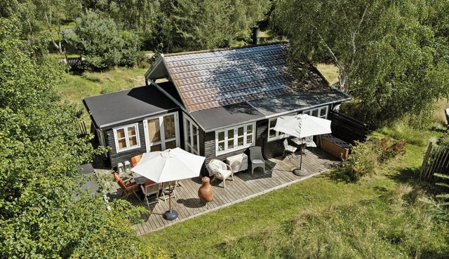 Wooden house with wild garden by Sejerø Bay