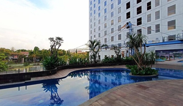 Wooden Touch Studio At Tamansari Skylounge Makassar Apartment