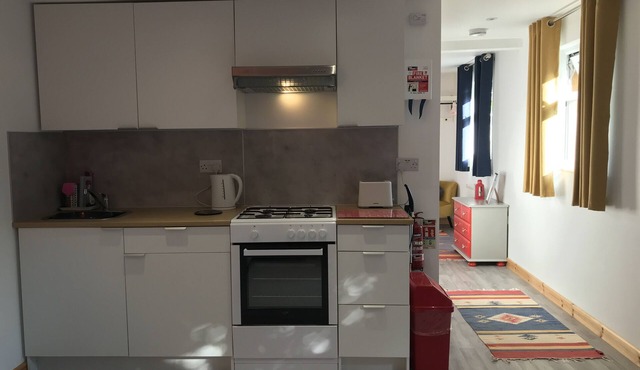 Woodpecker - our cosy, spacious glamping cabin at Mena Farm, Cornwall