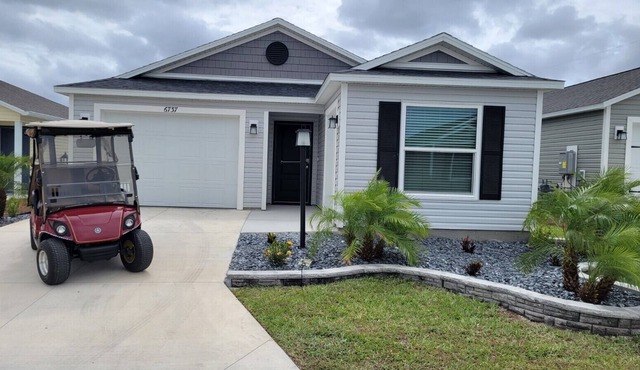 Wow! Beautiful three bedroom, two bath house nestled in the newest part of The Villages FL