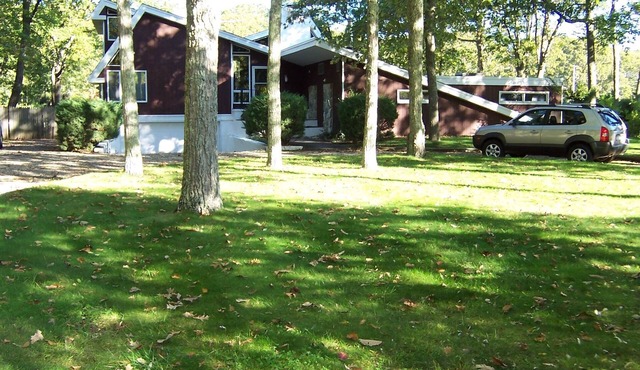 Year round family home on Shelter Island with indoor heated pool and dock.