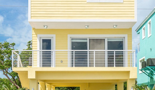 Yellow 3 Story Home