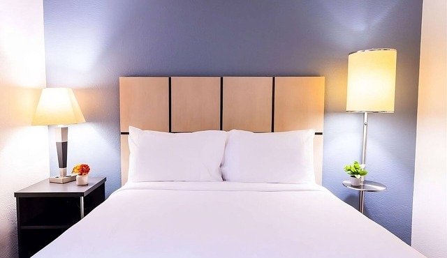 Your Home Away From Home! TWO Modern Suites, Full Kitchens, Pets are Welcome!