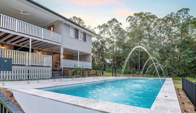 Your luxury retreat, tucked beneath the Glass House Mountains.