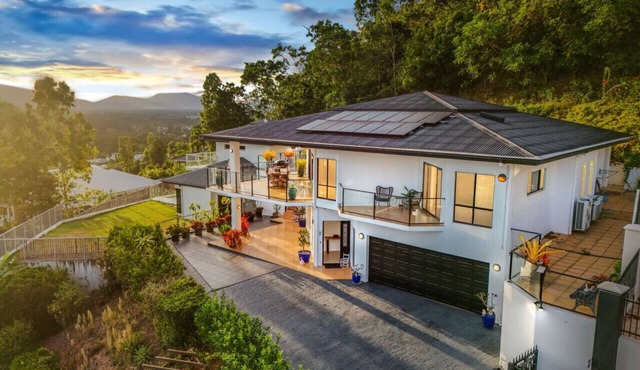 Your Ultimate Escape in Mooroobool- Luxury Tropical Retreat with Pool & Stunning Views – Perfect for Families & Groups!